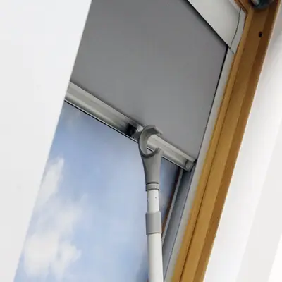 Telescopic pole opening a roof window blind